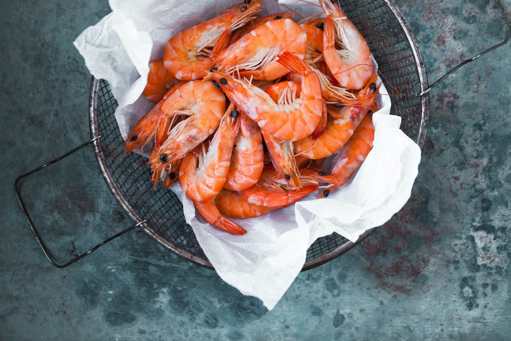 Shrimp prawn in strainer. Fresh king prawn ready prepare for grill. Top view. 