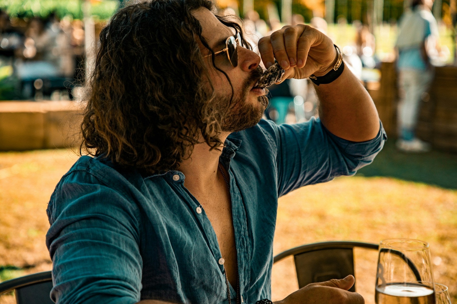 Man eating an oyster at a Low Country Oyster Roast