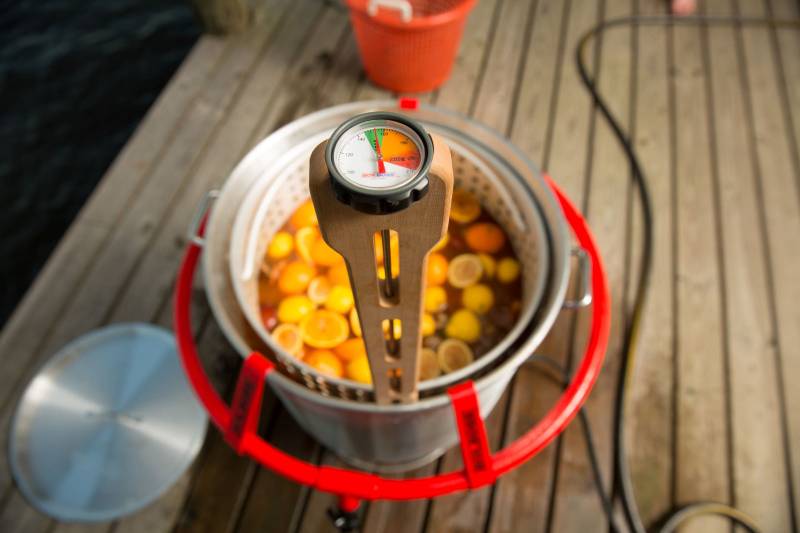 Boil Boss crab and shrimp boil accessories on a boiling pot