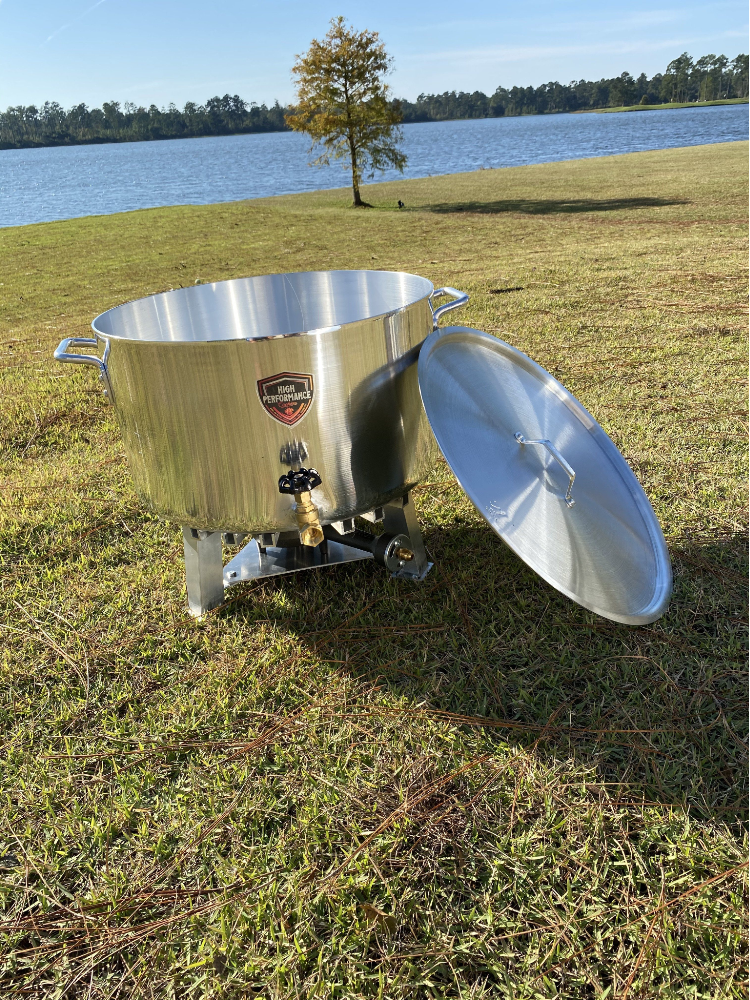 A propane cooking pot by a lake
